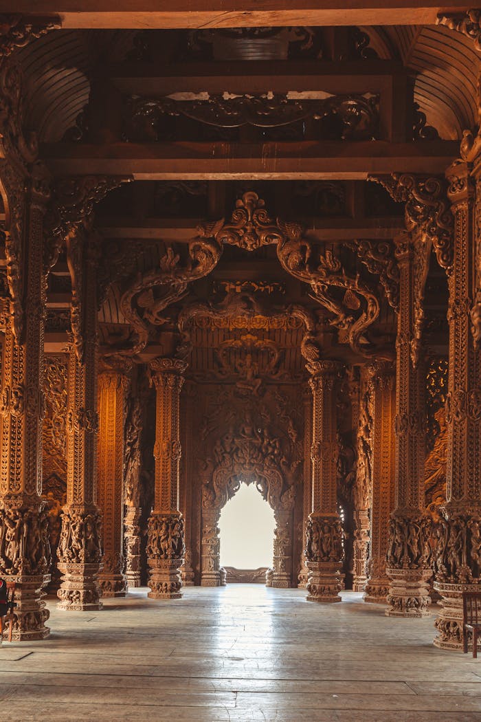 Explore the detailed wooden carvings at the Sanctuary of Truth in Pattaya, Thailand.
