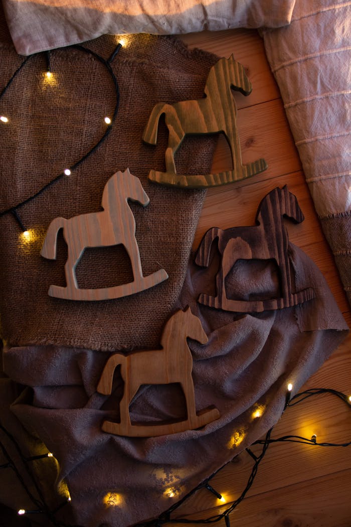 Charming wooden rocking horse decorations with cozy lighting, perfect for adding rustic charm to any home.
